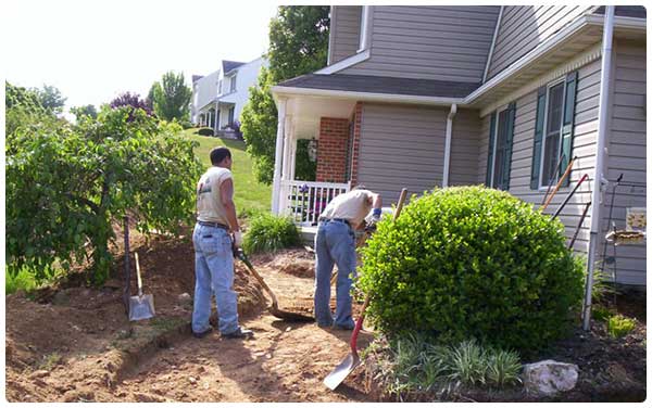 Lawn Maintenance — Men Digging Soil in Lin, PA