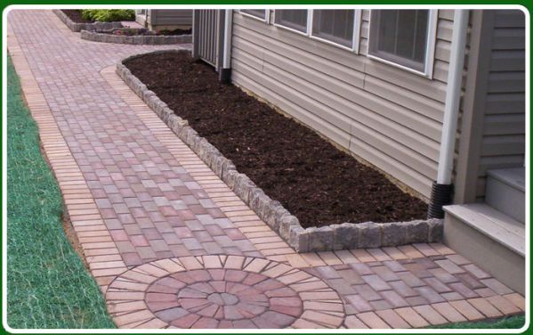 Affordable Mulch — Mulch Installation on Side of House in Garden Lin, PA